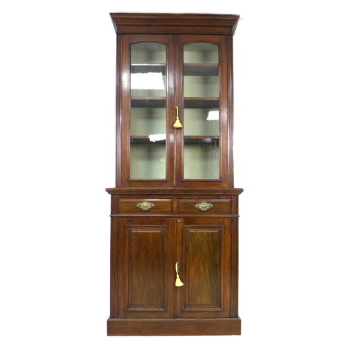 257 - An Edwardian mahogany bookcase, with three shelves behind two glazed doors, upon two drawers and a c... 