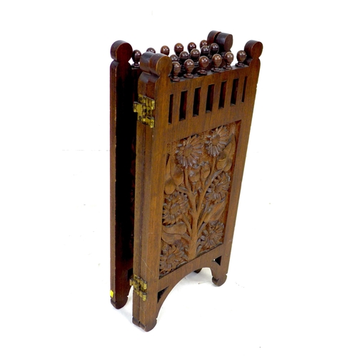 261 - An Edwardian three panel carved mahogany screen, decorated with panels of flowers, grapes and sunflo... 