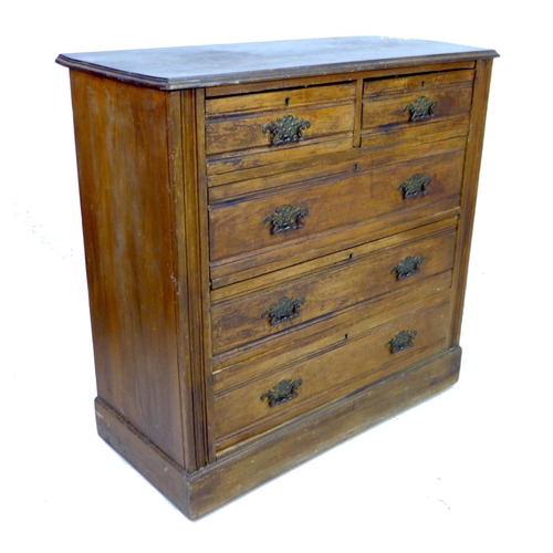 264 - An Edwardian walnut chest of two short over three long graduating drawers, with brass plate handles ... 