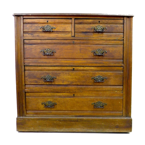 264 - An Edwardian walnut chest of two short over three long graduating drawers, with brass plate handles ... 