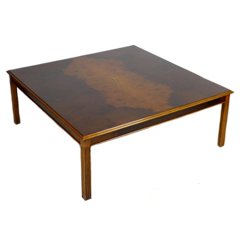 267 - A modern large coffee table, with square top and square section legs, veneered in burr walnut and wi... 