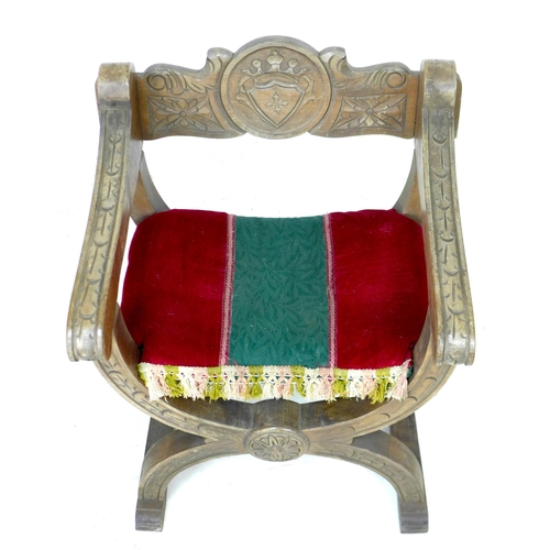 268 - A carved work curule open armchair with upholstered seat, 62 by 54 by 75cm high.