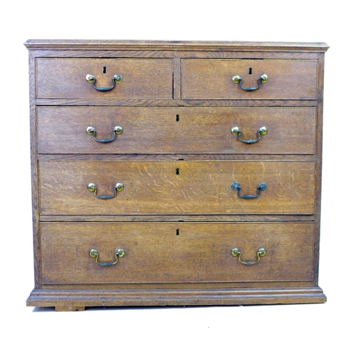 271 - A George III oak chest of two short over three long graduating drawers, with cock beading and brass ... 