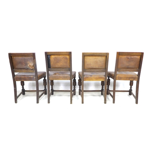 273 - A group of eight mid 20th century oak dining chairs, in Jacobean style, all with studded leather bac... 