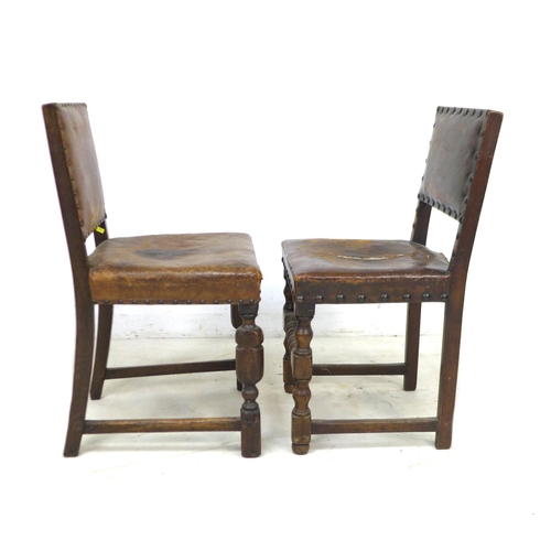 273 - A group of eight mid 20th century oak dining chairs, in Jacobean style, all with studded leather bac... 