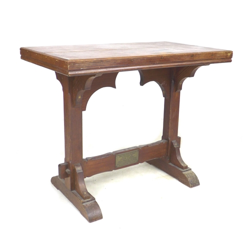 274 - Two 20th century tables, comprising a stained pitch pine side table, with memorial plaque to lower s... 