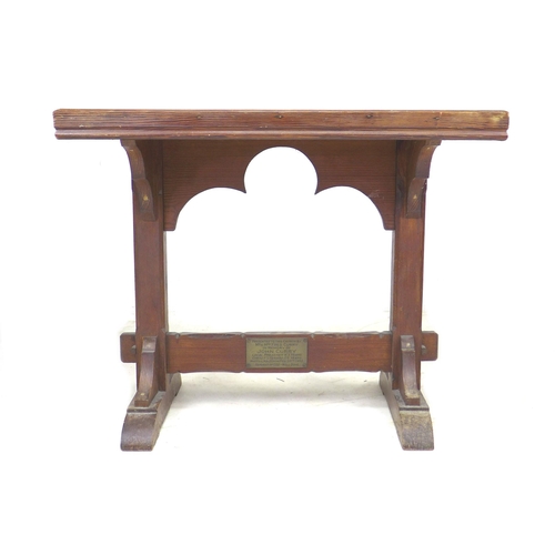 274 - Two 20th century tables, comprising a stained pitch pine side table, with memorial plaque to lower s... 