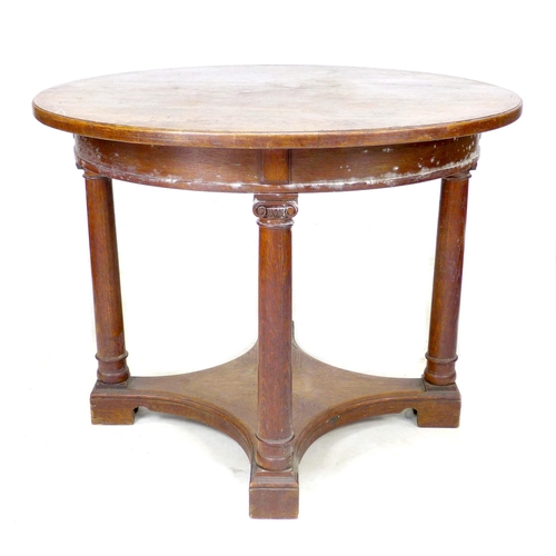 275 - A 20th century oak occasional table, with circular top raised on four pillars on block foot base, 10... 