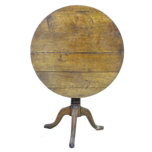 285 - A George III oak tilt top occasional table, with circular top, turned column and tripod base, 79 by ... 