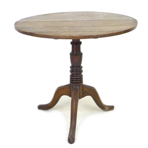 285 - A George III oak tilt top occasional table, with circular top, turned column and tripod base, 79 by ... 