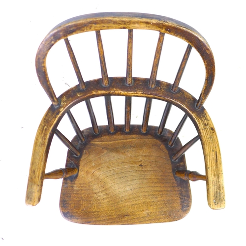 294 - A Victorian oak child's Windsor chair, with stick back and H stretcher, 40.5 by 48 by 63.5cm high.