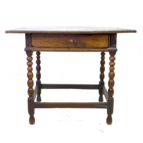 297 - A 17th century oak side table, the rectangular three plank surface with breadboard ends, above a sin... 