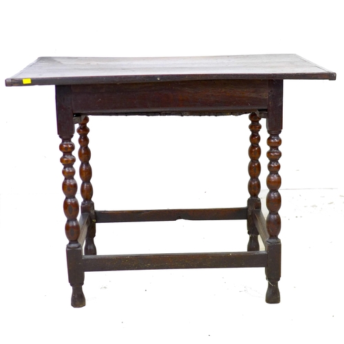 297 - A 17th century oak side table, the rectangular three plank surface with breadboard ends, above a sin... 