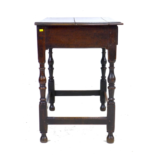 299 - A 17th century oak side table, the rectangular surface above a single frieze drawer with brass drop ... 