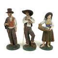 A group of three early to mid 20th century Portuguese terracotta figures, modelled as a fisher-women... 