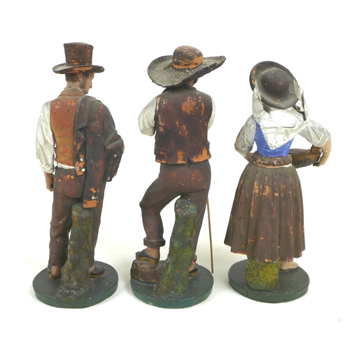 30 - A group of three early to mid 20th century Portuguese terracotta figures, modelled as a fisher-women... 