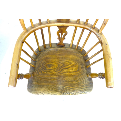 300 - A Georgian oak and yew Windsor armchair, low rounded back with pierced splat and stick supports, sha... 