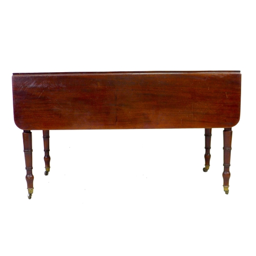 303 - A large Regency mahogany Pembroke table, single frieze drawer with brass knob, opposing false drawer... 