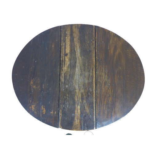 304 - A 17th century oak drop leaf table, with oval surface, twin gate leg action, pegged joints, raised o... 