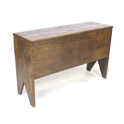 307 - A 17th century oak coffer, with lift lid and sides descending to V cut-out supports, 102 by 34 by 64... 