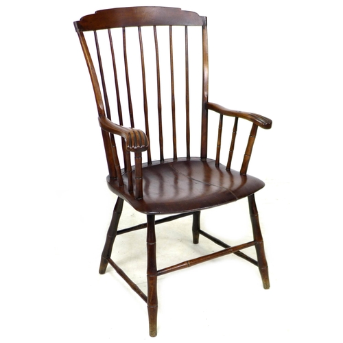 310 - An American 19th century 'Windsor' style open armchair, the high back with a stepped top rail suppor... 