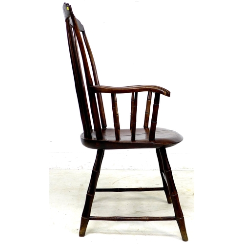 310 - An American 19th century 'Windsor' style open armchair, the high back with a stepped top rail suppor... 