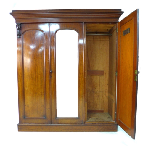 312 - A Victorian mahogany compactum, with double and single door compartments, both with hanging space an... 