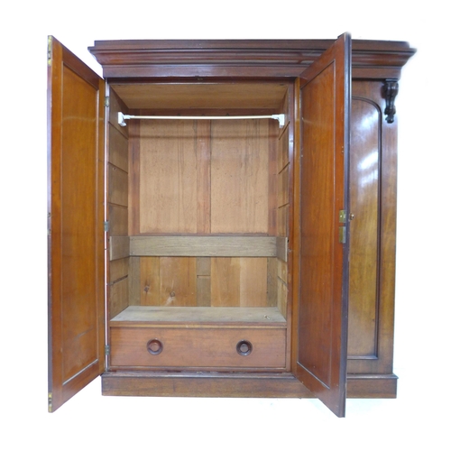 312 - A Victorian mahogany compactum, with double and single door compartments, both with hanging space an... 