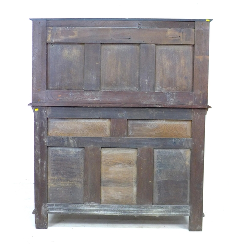 323 - A Victorian stained oak sideboard, the front carved with green man face masks, blind friezes of flow... 