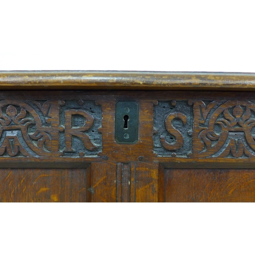 325 - An early 18th century oak coffer, with blind carved front, panelled sides, raised upon square sectio... 