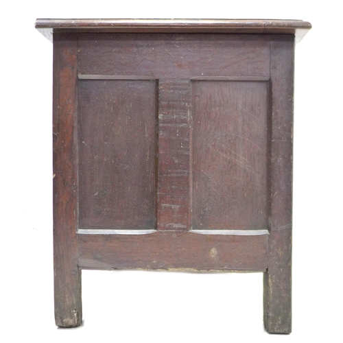 325 - An early 18th century oak coffer, with blind carved front, panelled sides, raised upon square sectio... 