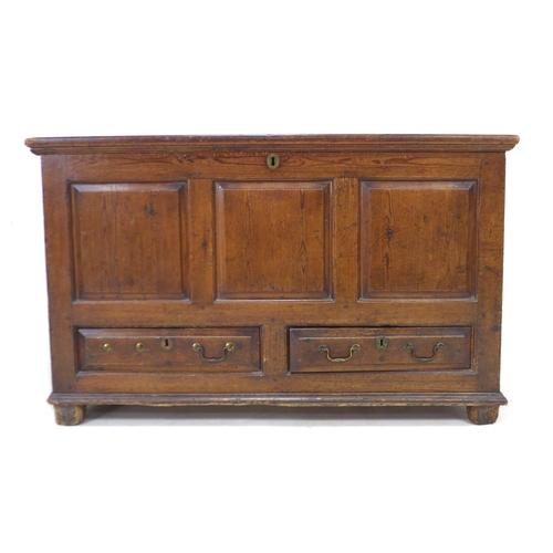 334 - An 18th century pine mule chest, with three carved panels to the front, over two drawers, raised on ... 