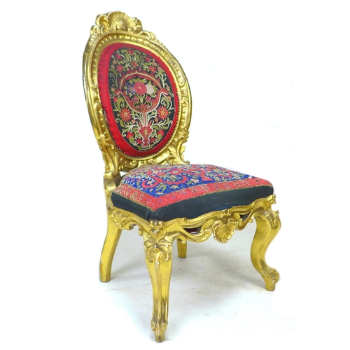 337 - A French early 19th century giltwood chair, with medallion back, shell and foliate decoration, uphol... 