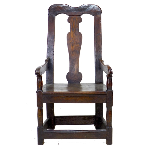 338 - A 17th century and later oak open armchair, the high back with vase shaped splat and shaped top rail... 