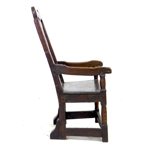 338 - A 17th century and later oak open armchair, the high back with vase shaped splat and shaped top rail... 