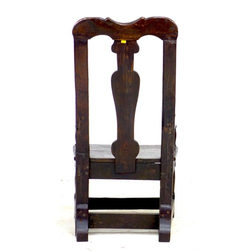 338 - A 17th century and later oak open armchair, the high back with vase shaped splat and shaped top rail... 