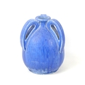 A Ruskin three-handled vase in blue, stamped 'Ruskin' to base, 17 by 22cm high.