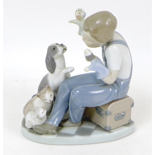 37 - A group of Lladro porcelain figures, comprising 'Puppet Show', 5736, 15cm high, boxed, 'Thinker Litt... 