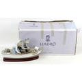 A Lladro porcelain figure group, 'Fishing with Gramps', 5215, 39cm long, a/f, in original box.
