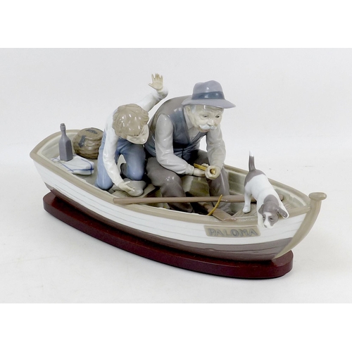 38 - A Lladro porcelain figure group, 'Fishing with Gramps', 5215, 39cm long, a/f, in original box.