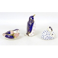 Three Royal Crown Derby paperweights, modelled as a penguin, 13.5cm high, a partridge, 6cm high, a r... 