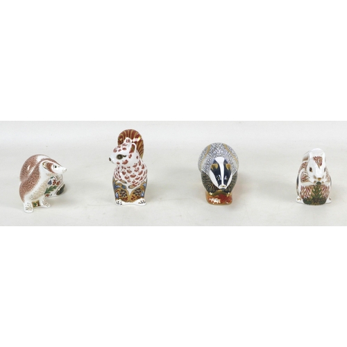 64 - Four Royal Crown Derby paperweights, modelled as a a 