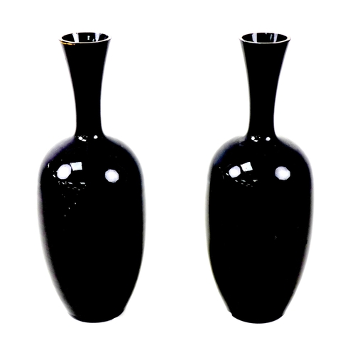 69 - Two Mary Gregory style vases, each with applied decoration of a young girl playing outside, on black... 