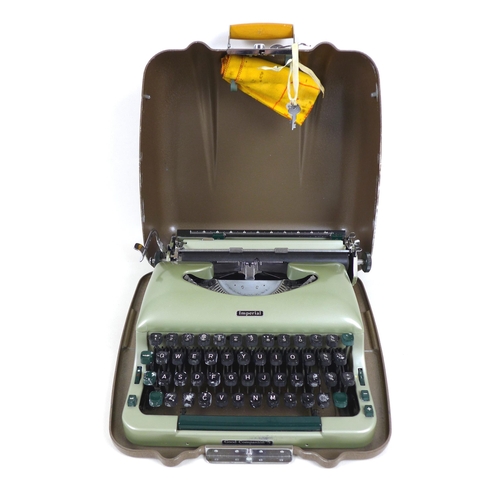 72 - A 20th century Imperial 'Good Companion 5' portable typewriter, in pale green, with two keys, origin... 