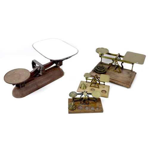 83 - A collection of Victorian brass bell weights and weighing scales, including twenty-four bell weights... 