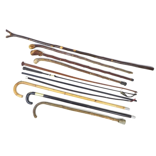 90 - A group of eleven walking sticks and switches, including two horse measuring sticks. (11)