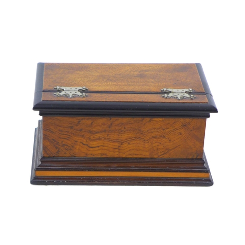 94 - An Edwardian oak casket box, with ebonised edges, lift lid opening to reveal a satinwood lined inter... 