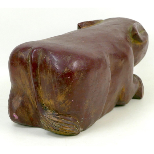 95 - A 20th century carved wooden shabby chic pig, painted maroon, 46 by 19 by 18cm high.