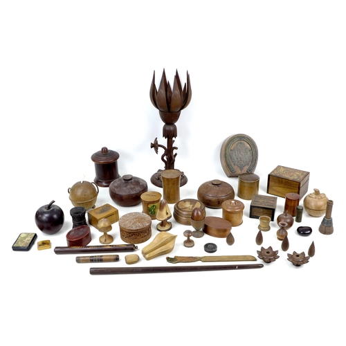 99 - A large collection of treen items, including a mauchline ware money box, 8 by 6 by 4.5cm high, toget... 