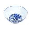 A Chinese porcelain blue and white bowl, 20th century, bearing a six character Qing dynasty mark to ... 